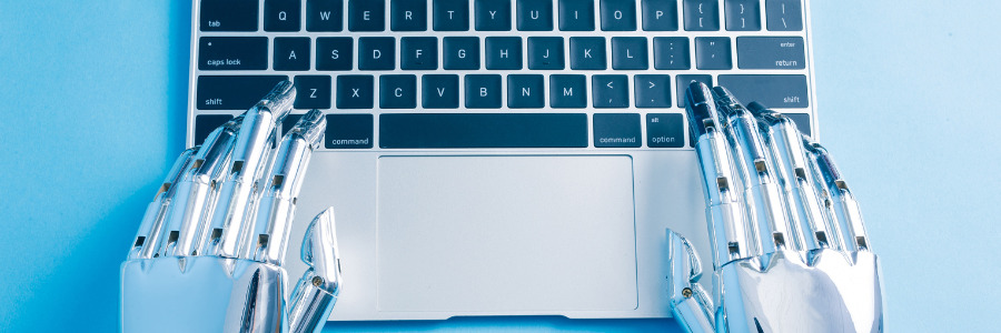 ChatGPT in businesses, robot typing on the keyboard